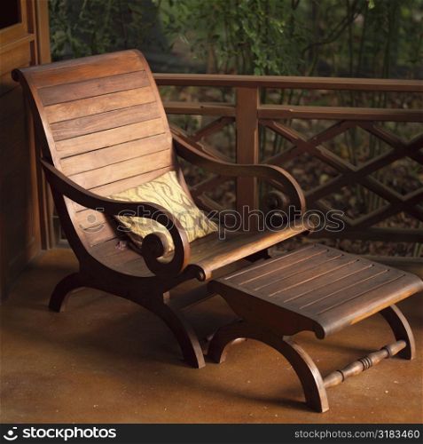 Empty wooden lounge chair
