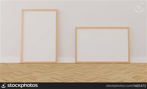 Empty wooden photo poster frames laying on floor. Mockup 3D rendering.