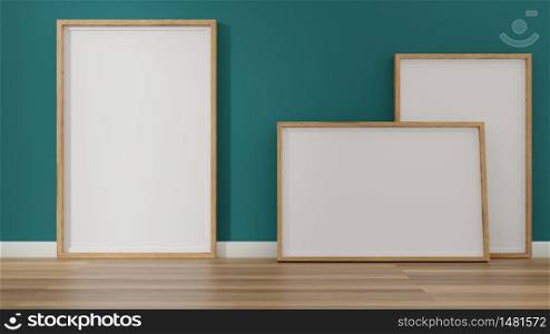 Empty wooden photo poster frames laying on floor. Mockup 3D rendering.