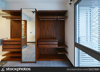 Empty wooden shelf and cabinet and bathroom, interior design