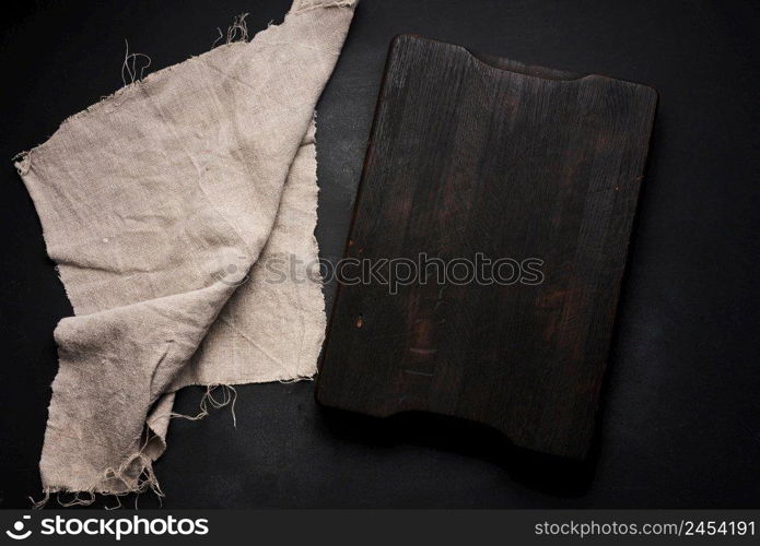 empty wooden square cutting board on black table, food display template, top view