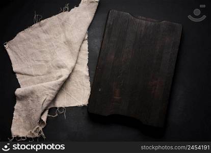 empty wooden square cutting board on black table, food display template, top view