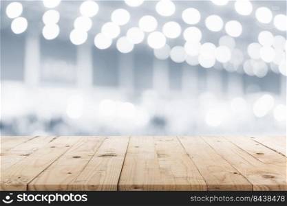 Empty wooden table and abstract blurred image background display montage for product.