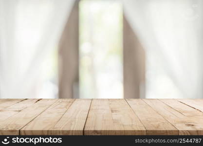 Empty wooden table and blur window background with copy space, display montage for product.