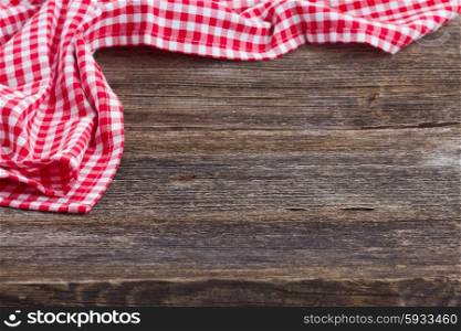 empty wooden table and cloth red napkin. frame of blue napkin