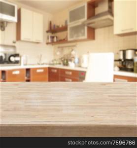 empty wooden table in a modern light kitchen. table in a kitchen