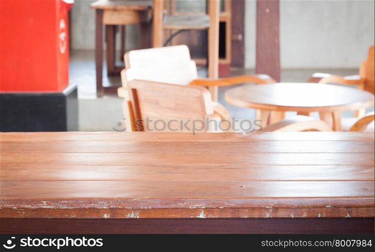Empty wooden table in coffee shop, stock photo