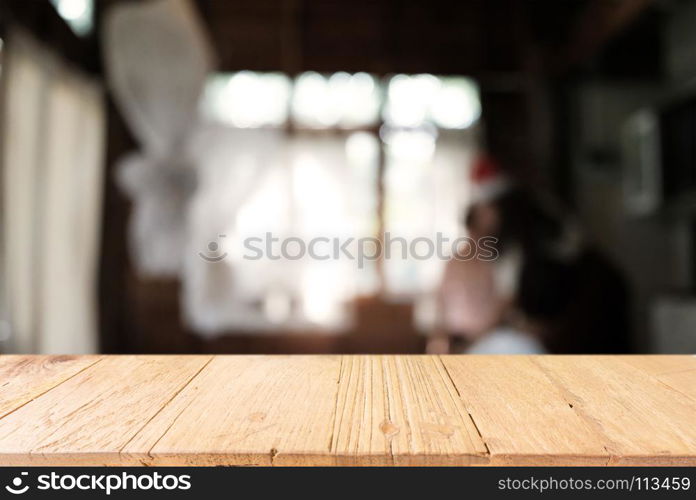 Empty wooden table in front of abstract blurred background of coffee shop . can be used for display or montage your products.Mock up for display of product