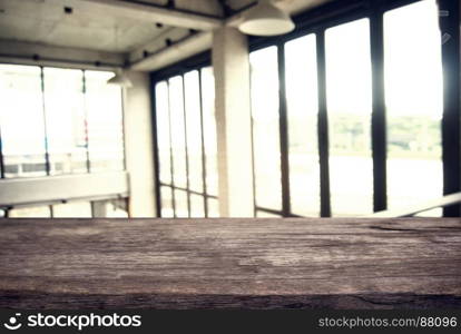 Empty wooden table in front of abstract blurred background of coffee shop . can be used for display or montage your products.Mock up for display of product.