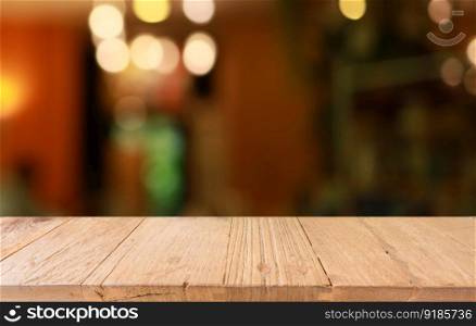 Empty wooden table in front of abstract blurred background of coffee shop . wood table in front can be used for display or montage your products.Mock up for display of product 