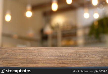 Empty wooden table in front of abstract blurred background of coffee shop . wood table in front can be used for display or montage your products.Mock up for display of product 