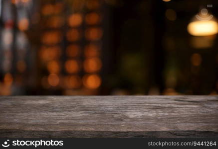 Empty wooden table in front of abstract blurred background of coffee shop . wood table in front can be used for display or montage your products.Mock up for display of product 