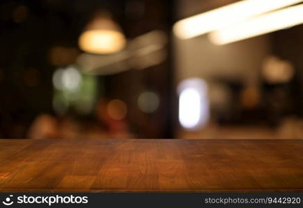 Empty wooden table in front of abstract blurred background of coffee shop . wood table in front can be used for display or montage your products.Mock up for display of product 