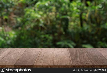 Empty wooden table in front of abstract blurred background of coffee shop . wood table in front can be used for display or montage your products.Mock up for display of product 