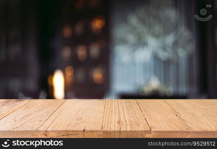 Empty wooden table in front of abstract blurred background of coffee shop . wood table in front can be used for display or montage your products.Mock up for display of product
