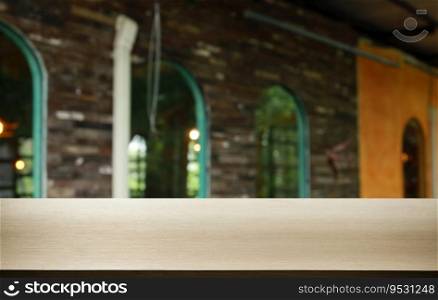 Empty wooden table in front of abstract blurred background of coffee shop . wood table in front can be used for display or montage your products.Mock up for display of product
