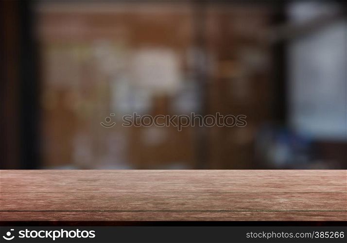 Empty wooden table in front of abstract blurred indoor house room interior background. For montage product display or design key visual layout - Image