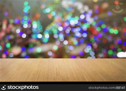 Empty wooden table in front of abstract bokeh background . can be used for display or montage your products.Mock up for display of product. for Christmas, new year celebration