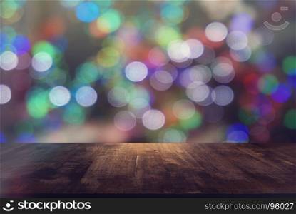 Empty wooden table in front of abstract bokeh background . can be used for display or montage your products.Mock up for display of product. for Christmas, new year celebration