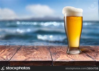 Empty wooden table with blurred sea on background, natural background with bokeh