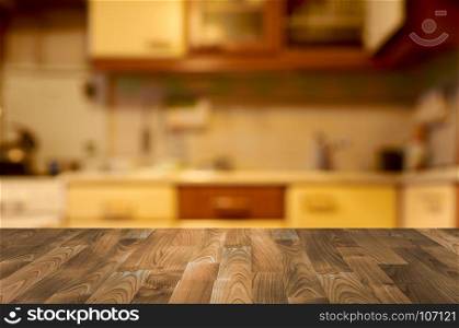 Empty wooden table with kitchen bokeh