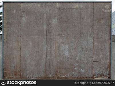 Empty wooden wall for a poster (placard), space for text