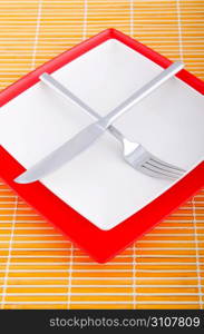 Emtpy plates with utensils on table