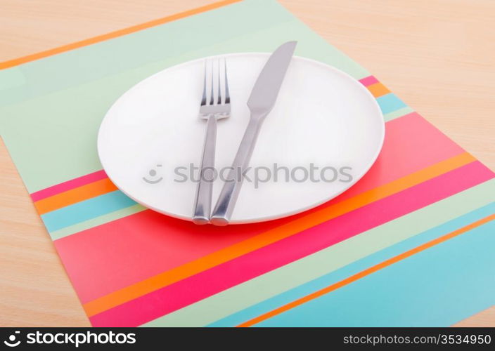 Emtpy plates with utensils on table