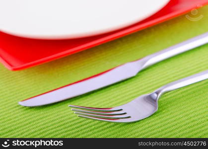 Emtpy plates with utensils on table