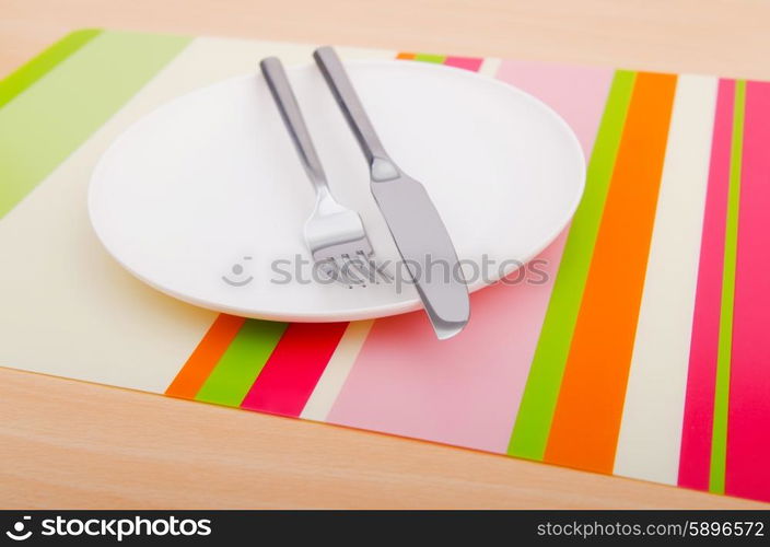 Emtpy plates with utensils on table