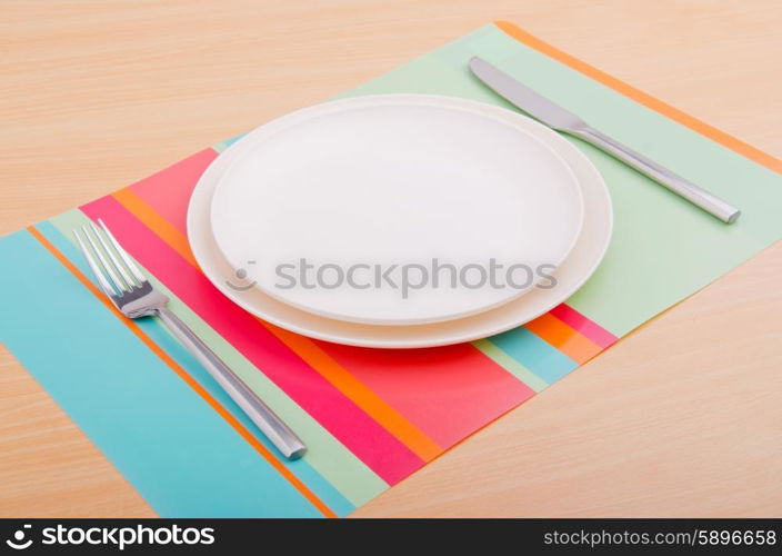 Emtpy plates with utensils on table