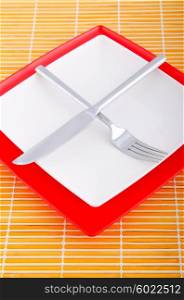 Emtpy plates with utensils on table