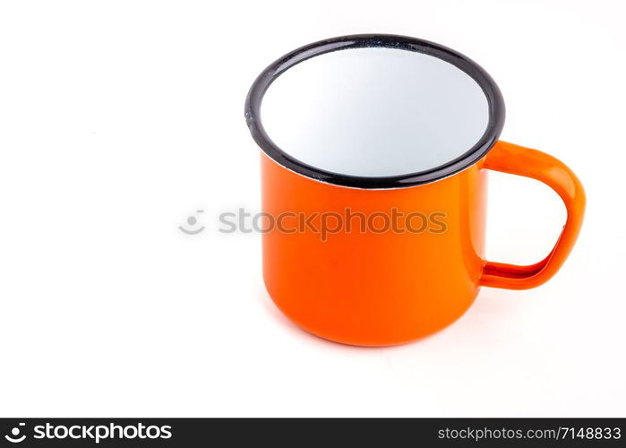 Enamel metal camp mug for coffee or tea on white background. Enamel camp mug