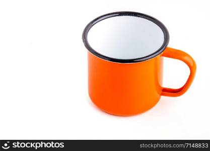 Enamel metal camp mug for coffee or tea on white background. Enamel camp mug