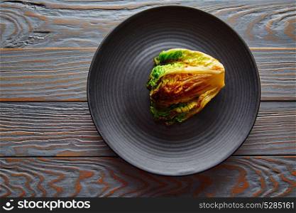 endive little Lettuce grilled with vinaigrette sauce on black plate