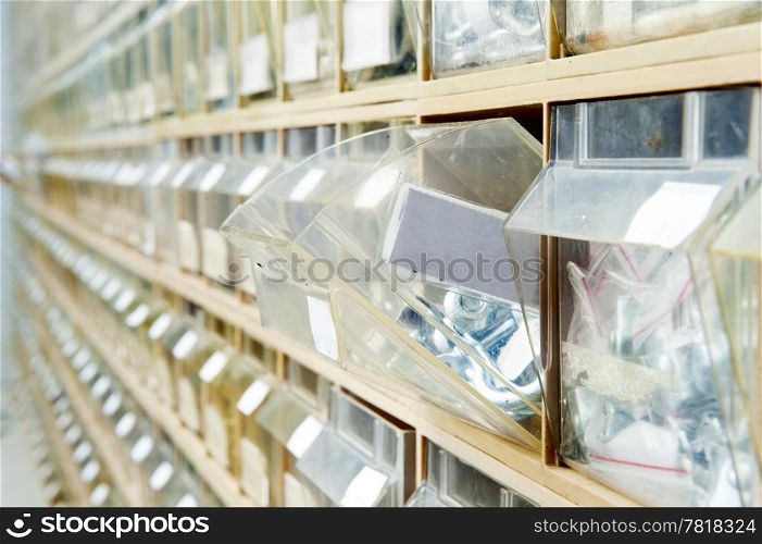 Endless rows of hardware in shelves, containing a wide selection of fasteners