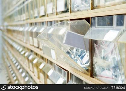 Endless rows of hardware in shelves, containing a wide selection of fasteners