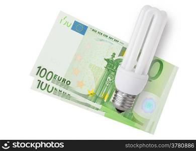 Enegy saver bulb over euro bills on white background