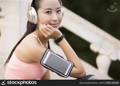 Energetic beauty listening to music for fitness