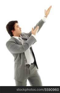 energetic businessman showing imaginary product over white