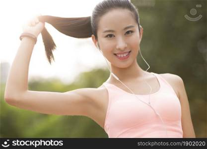 Energetic young woman doing exercise