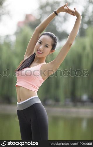 Energetic young woman doing exercise