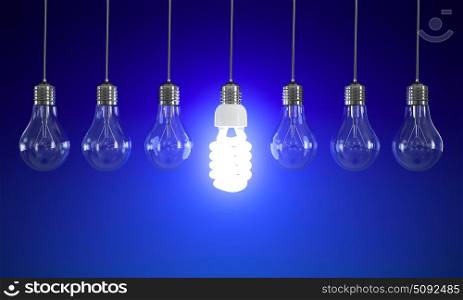 Energy saving and simple light bulbs isolated on blue background.