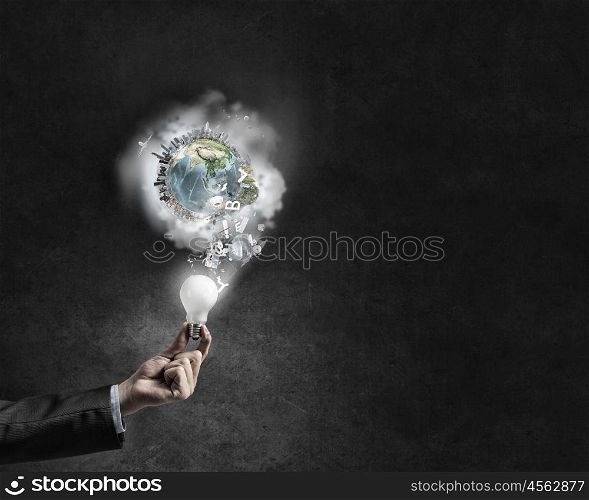 Energy saving. Businessman hand holding glowing light bulb. Elements of this image are furnished by NASA