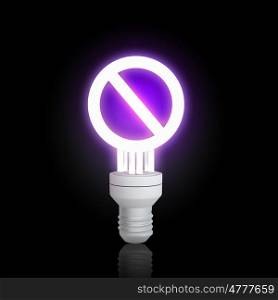 Energy saving concept. Glowing electrical light bulb on dark background