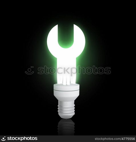 Energy saving concept. Light bulb glowing icon on dark background