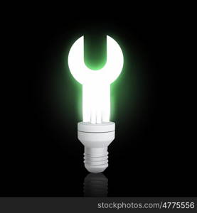 Energy saving concept. Light bulb glowing icon on dark background