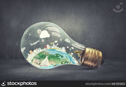 Energy saving concept. Planet Earth inside of light bulb. Elements of this image are furnished by NASA