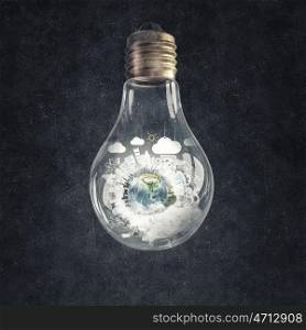 Energy saving concept. Planet Earth inside of light bulb. Elements of this image are furnished by NASA