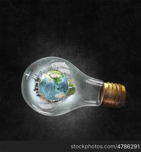 Energy saving concept. Planet Earth inside of light bulb. Elements of this image are furnished by NASA